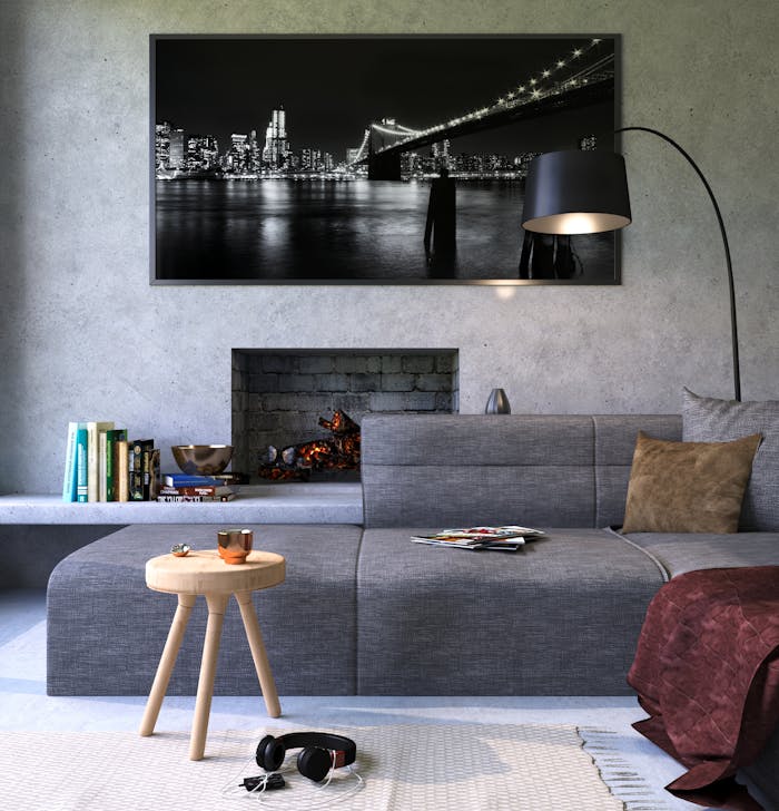 The Art of Drawing Readers In: Your attractive post title goes here Modern gray living room featuring a fireplace and cityscape artwork, creating a cozy ambiance.